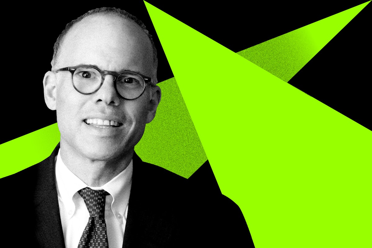 Andrew Weiss in front of a green and black background