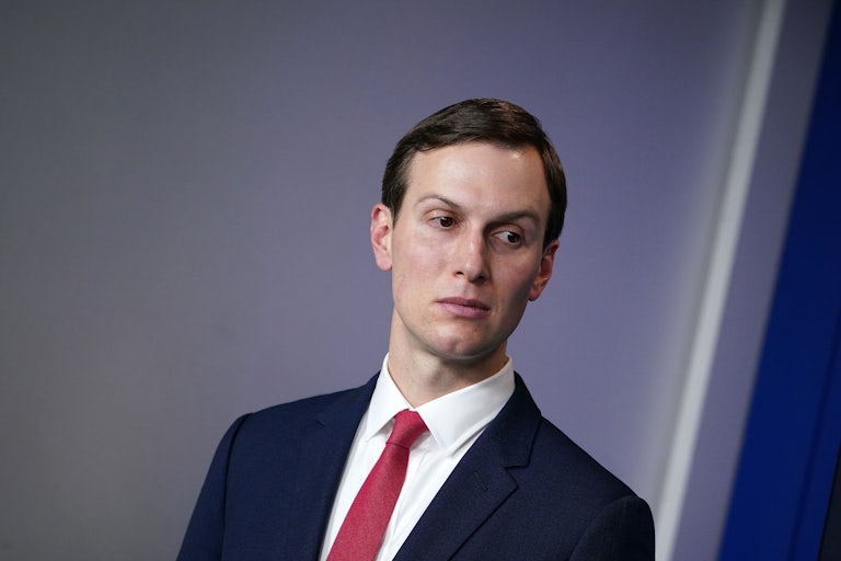 A close-up of Jared Kushner as he casts a glance to the left.