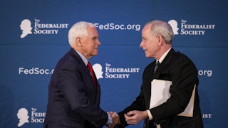 Former Vice President Mike Pence shakes hands with with Federalist Society Senior Vice President Dean Reuter in April of 2023. Reuter is one of several individuals who might be tapped to run the Federalist Society.