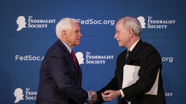 Former Vice President Mike Pence shakes hands with with Federalist Society Senior Vice President Dean Reuter in April of 2023. Reuter is one of several individuals who might be tapped to run the Federalist Society.
