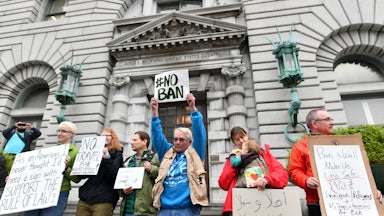 Protesters against President Donald Trump's proposed Muslim ban stand in front of the United States Court of Appeals for the Ninth Circuit in San Francisco, California on February 7, 2017.