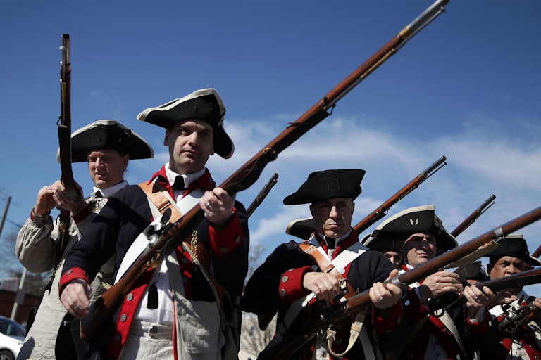 Members of the First Virginia Regiment, a Revolutionary War living history reenactment group, participate in the annual George Washington Birthday Parade in Virginia.