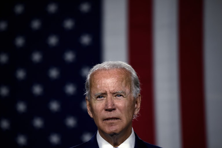 Biden speaks in front of American flag