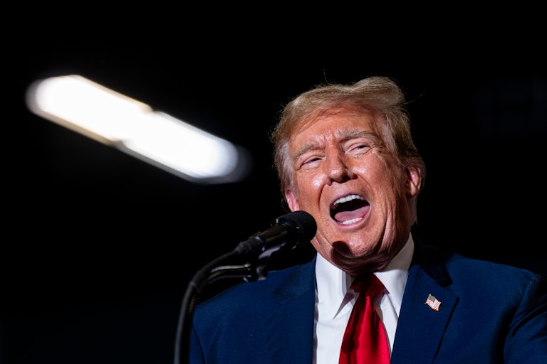 Donald Trump yells at a mic