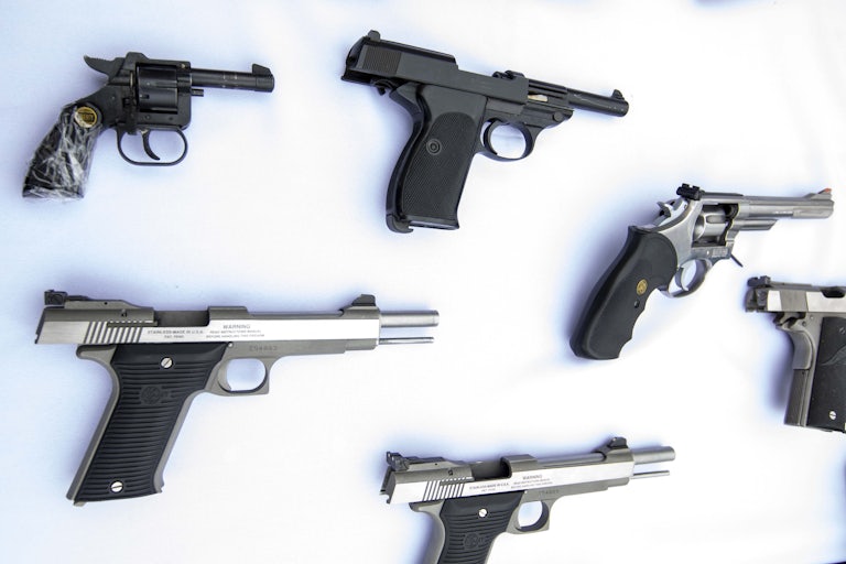 Several handguns on a table