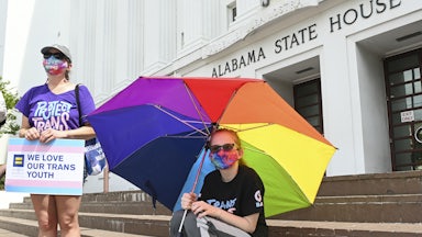 Christa White (L) and her daughter protest anti-LGBTQ legislation outside the Alabama State House