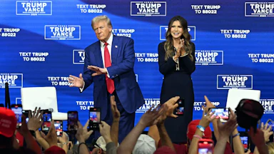 Trump with South Dakota Governor Kristi Noem at a town hall in Oaks, Pennsylvania