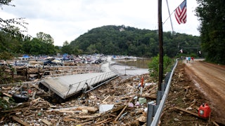 The Rocky Broad River flows into Lake Lure and overflows the town with debris from Chimney Rock, North Carolina after heavy rains from Hurricane Helene on September 28, 2024, in Lake Lure, North Carolina.