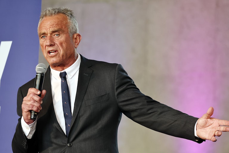Robert F. Kennedy Jr. speaks into a microphone while gesturing