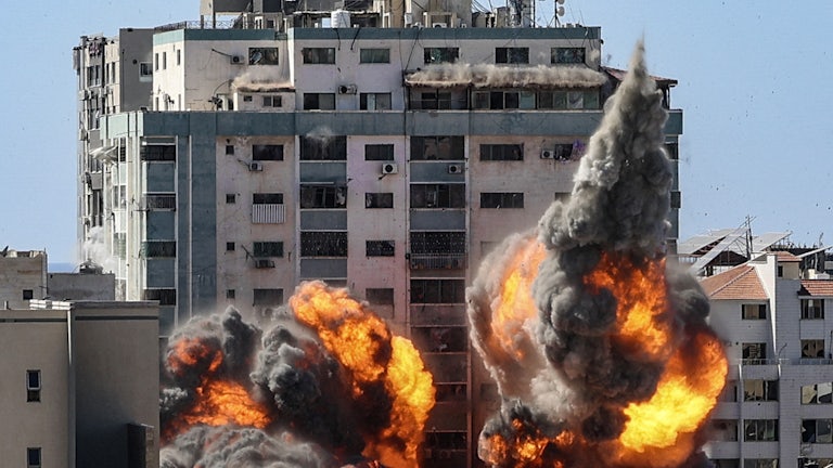 Explosions are seen as the Israeli military strikes the headquarters of the Associated Press in Gaza.
