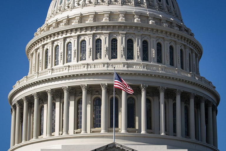 Capitol building with American flag in front