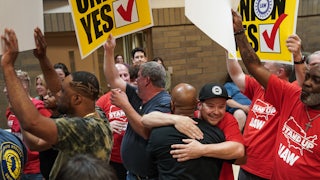 People embrace and celebrate.