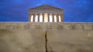The facade of the Supreme Court can be seen at sunrise.