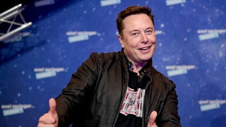 Tesla's Elon Musk makes a thumbs-up gesture.