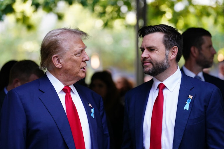 Donald Trump and J.D. Vance look at each other