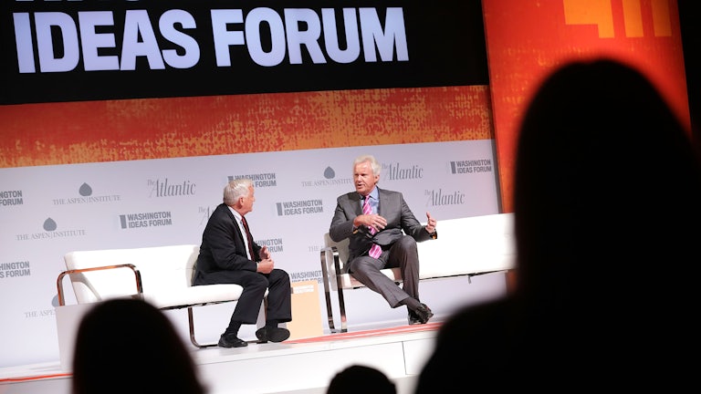Aspen Institute President Walter Isaacson interviews GE Chairman Jeff Immelt on a stage at an ideas festival.