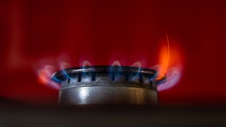 A close-up image of the flame of a gas stove