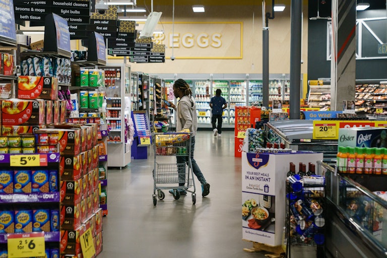 Shoppers are seen in a supermarket.