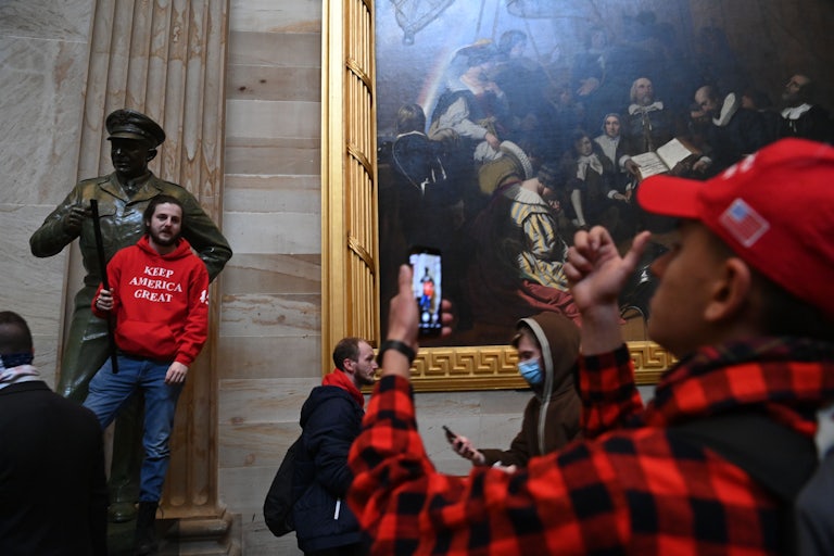 Supporters of Donald Trump photograph one another during the riot on Capitol Hill