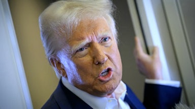 Donald Trump speaks to reporters on Air Force One