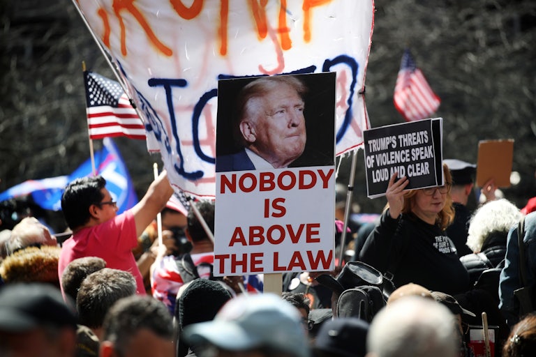 Anti-Trump demonstrators outside of the Manhattan Criminal Court