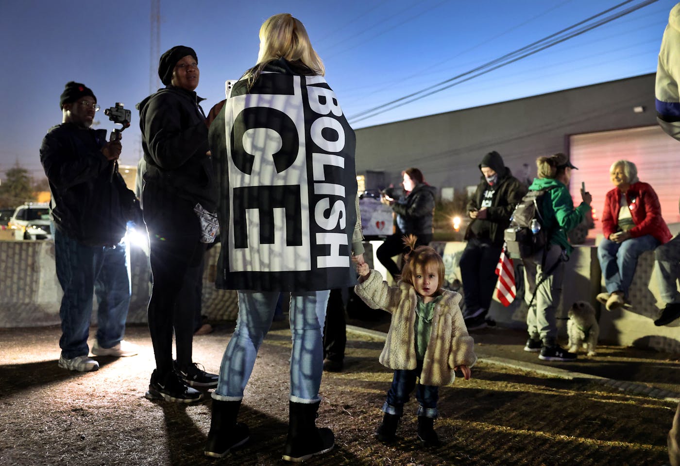 A photo from November 14, at a protest outside the Broadview detention center, Megan Siegel held hands with her daughter, Matilda.