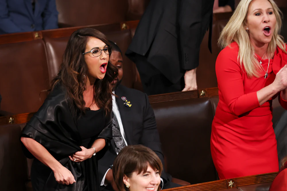 Representatives Lauren Boebert and Marjorie Taylor Greene shout at Biden