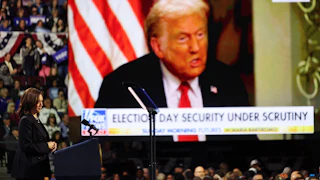 Kamala Harris watches a video of Donald Trump during a campaign rally at Erie Insurance Arena in Erie, Pennsylvania, on October 14.