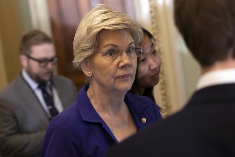Elizabeth Warren wearing a purple suit