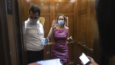 Kyrsten Sinema boards an elevator at the U.S. Capitol