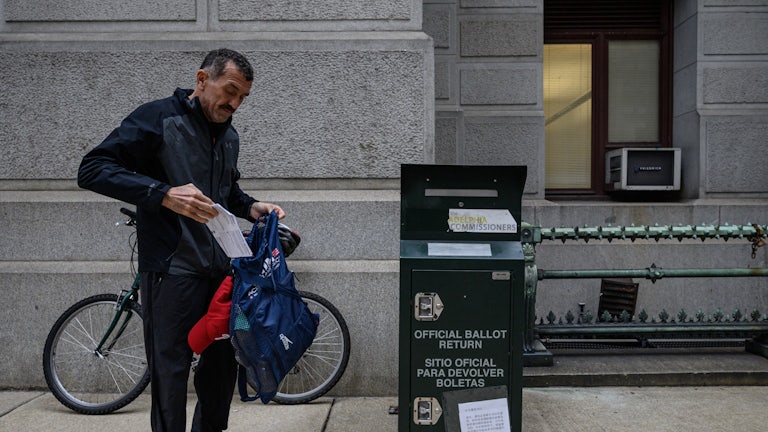 A voter casts their ballot at a drop box outside Philadelphia City Hall. Pennsylvania is one of numerous states where control of the state legislature is on the line in this year's midterm elections. 