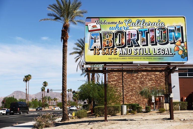 A billboard reads, “Welcome to California where abortion is safe and still legal” on July 12 in Rancho Mirage, California.