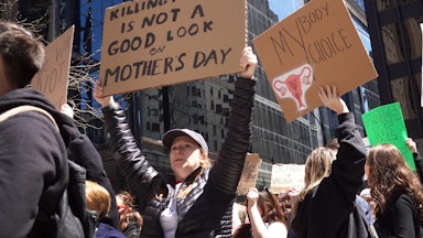 Abortion rights demonstrators rally before marching through downtown Chicago.