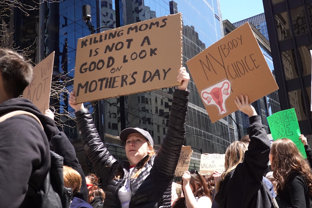 Abortion rights demonstrators rally before marching through downtown Chicago.