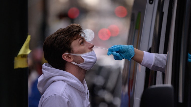 A man receives a nasal swab.