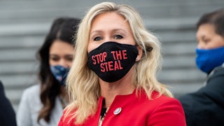 Marjorie Taylor Greene wears a "Stop The Steal" mask.