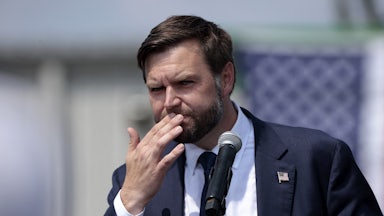 J.D. Vance touches his mouth while speaking during a Donald Trump campaign event