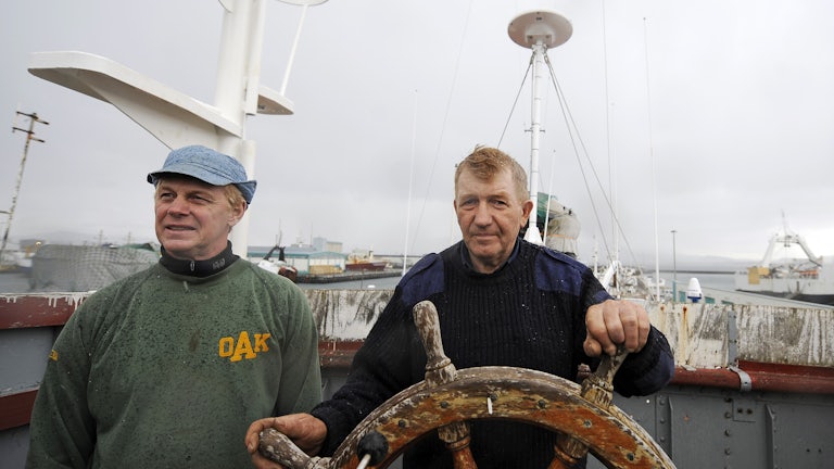 Whaler and captain Olafur Olafsson and his number two Hafstian Omar thorstainsson stand at the helm of a restored whaling vessel.