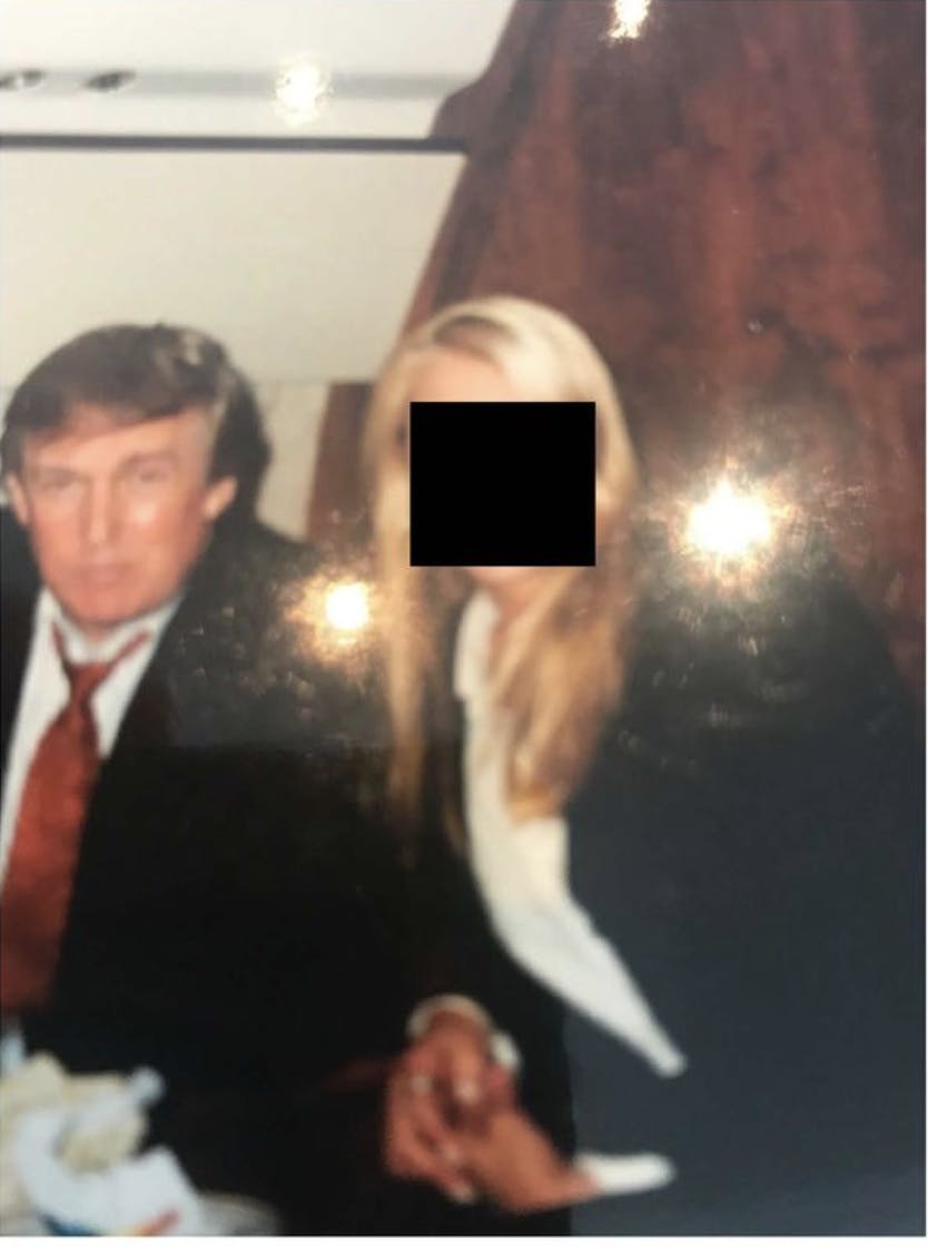 Donald Trump and a woman whose face was blacked out