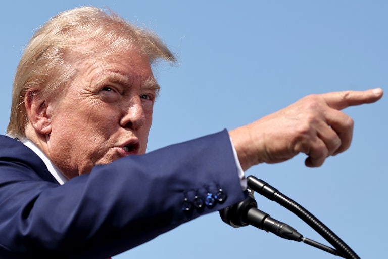 Donald Trump yells and points during a press conference