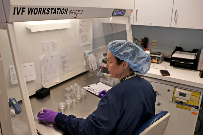 An embryologist at her IVF station