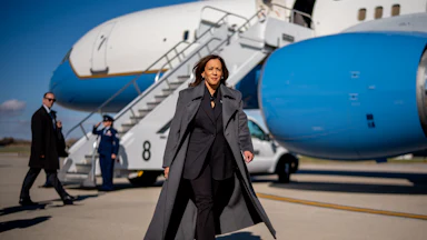Kamala Harris confidently strides in front of Air Force Two.