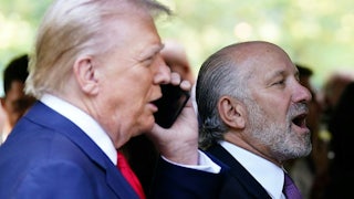 Donald Trump and Howard Lutnick are seen in profile as they stand next to each other