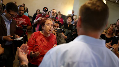 A constituent talks with then-Congressman Jeff Denham, a California Republican