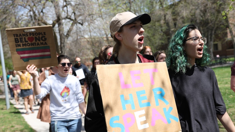 Transgender rights activists march through the University of Montana campus in Missoula
