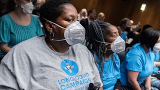 Long covid activists attend the Senate Appropriations Subcommittee hearing on the National Institutes of Health budget.