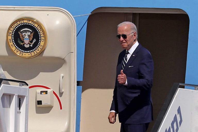 Joe Biden gives a thumbs up as he heads onto Air Force One