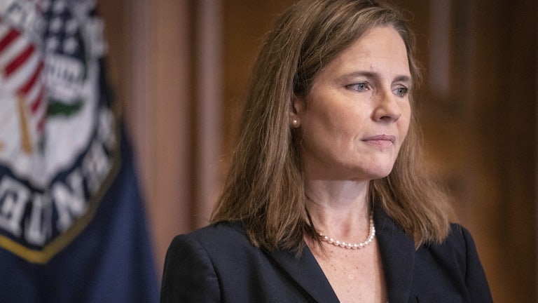 A close-up of Justice Amy Coney Barrett in profile.