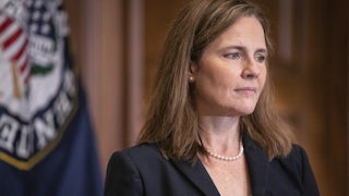 A close-up of Justice Amy Coney Barrett in profile.