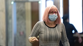 Senator Kyrsten Sinema of Arizona wears a protective mask while arriving at the Capitol on December 11. 